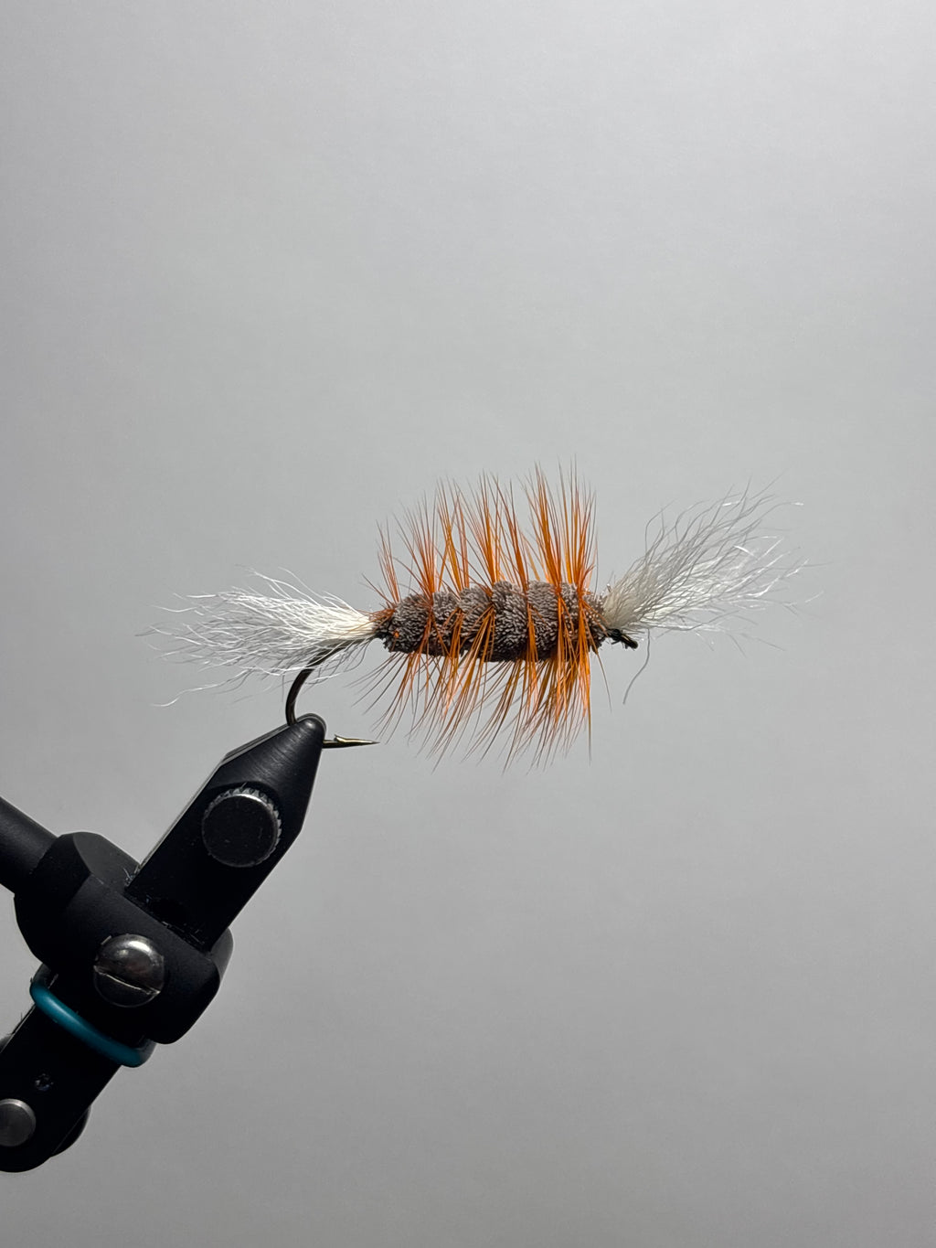 Double wing brown body orange hackle bomber