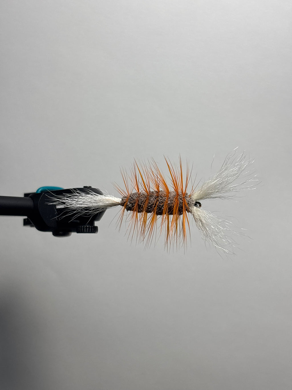 Double wing brown body orange hackle bomber