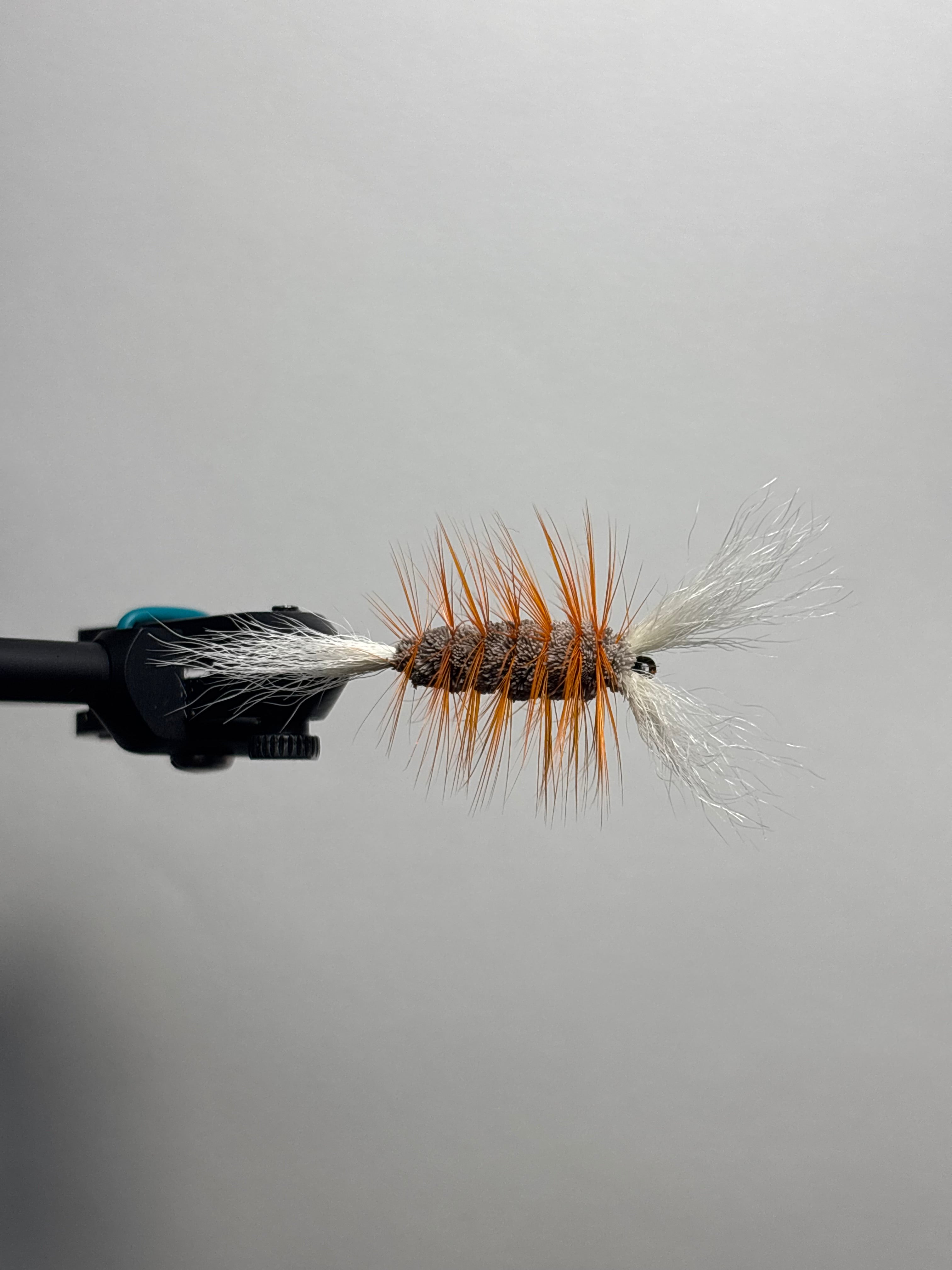 Double wing brown body orange hackle bomber