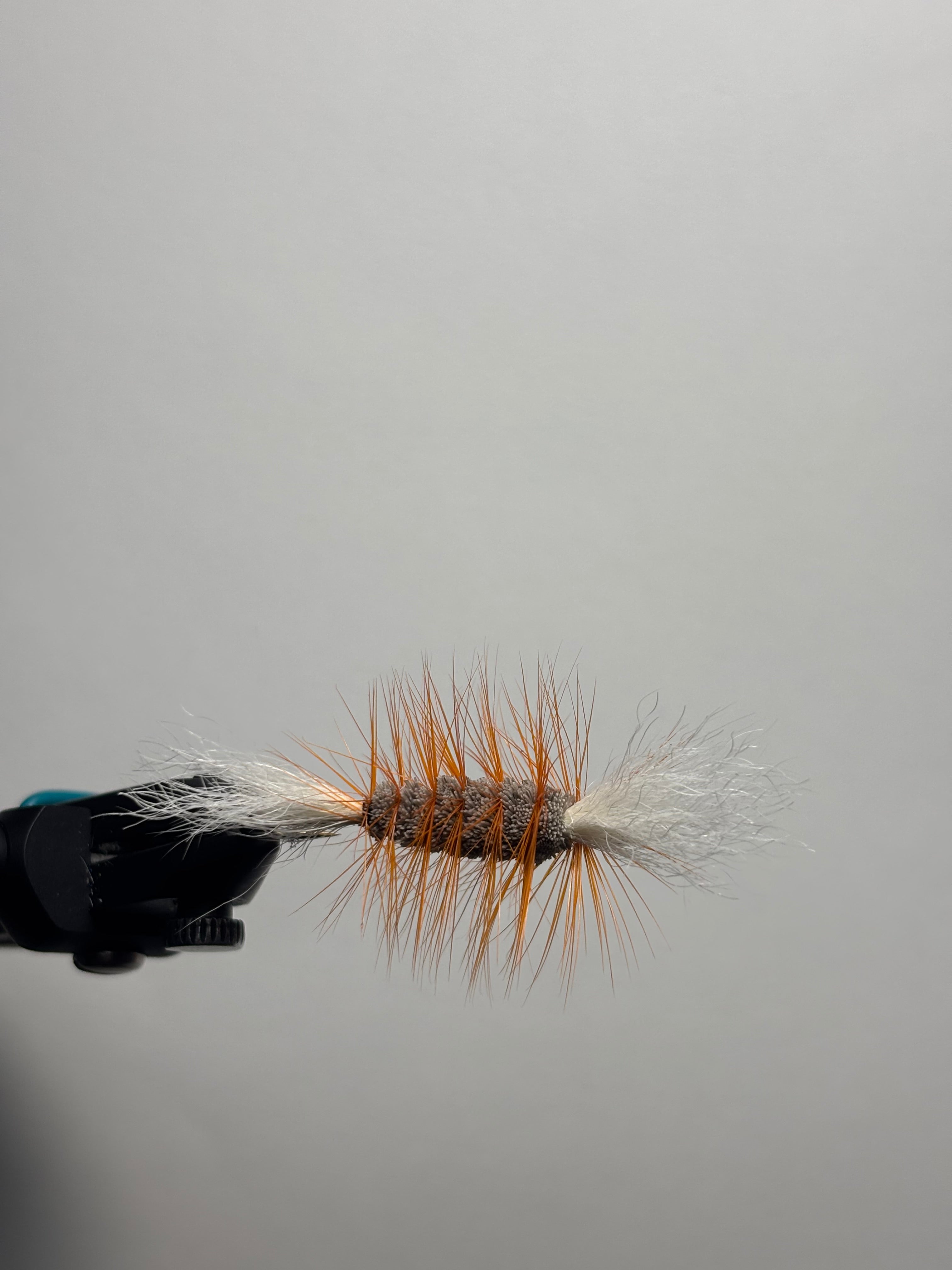 Single wing brown body orange hackle bomber