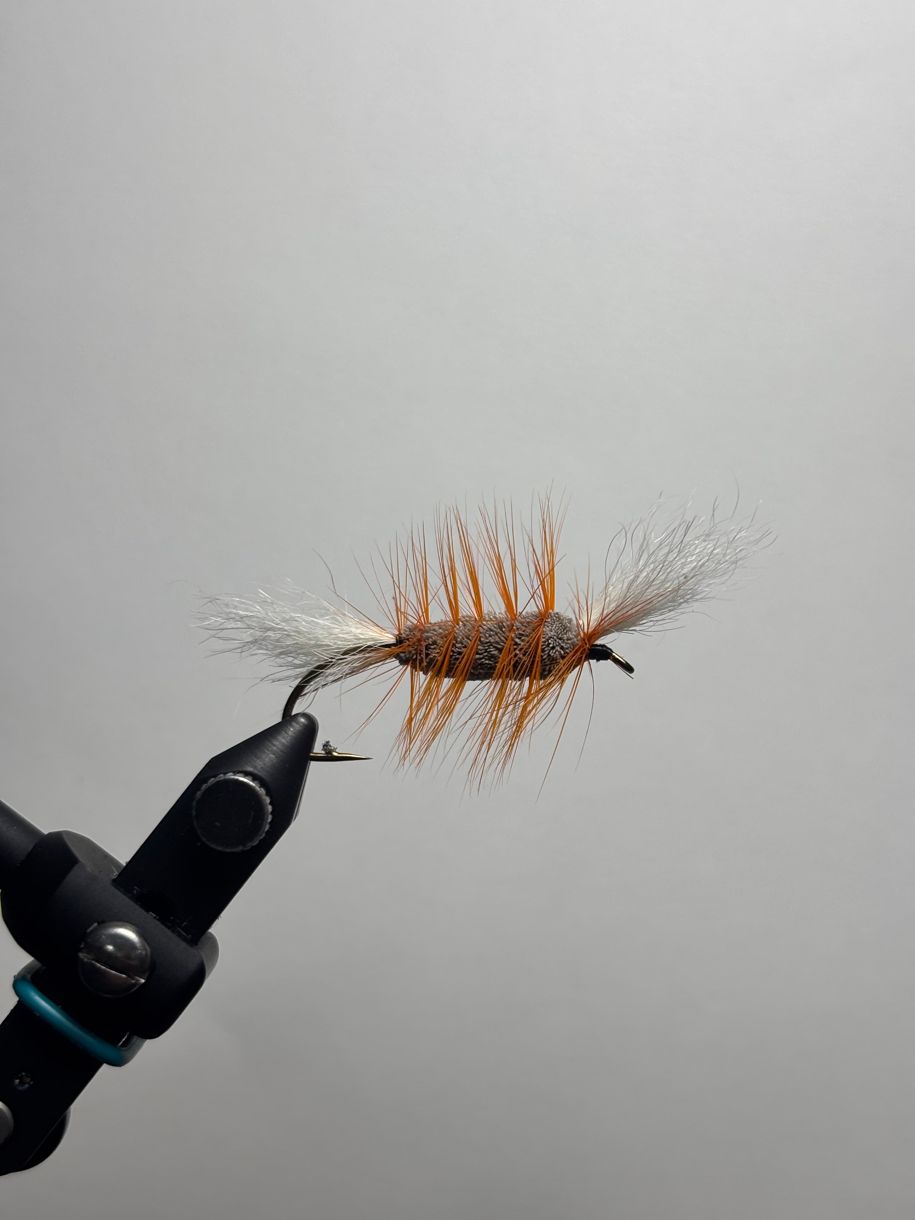 Single wing brown body orange hackle bomber